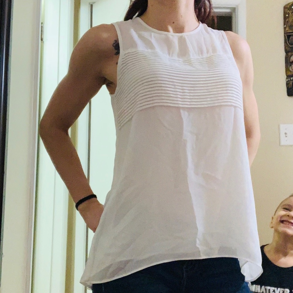 Sheer white sleeveless blouse